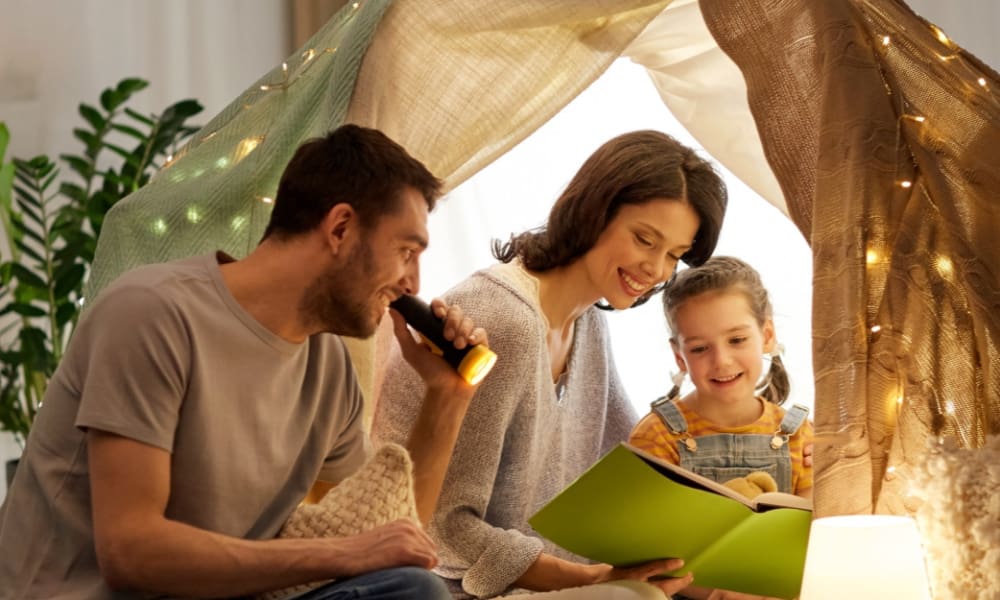 A Half Dozen Ways to Save On Homeowner’s Insurance - Young Family Spending Time Together at Home