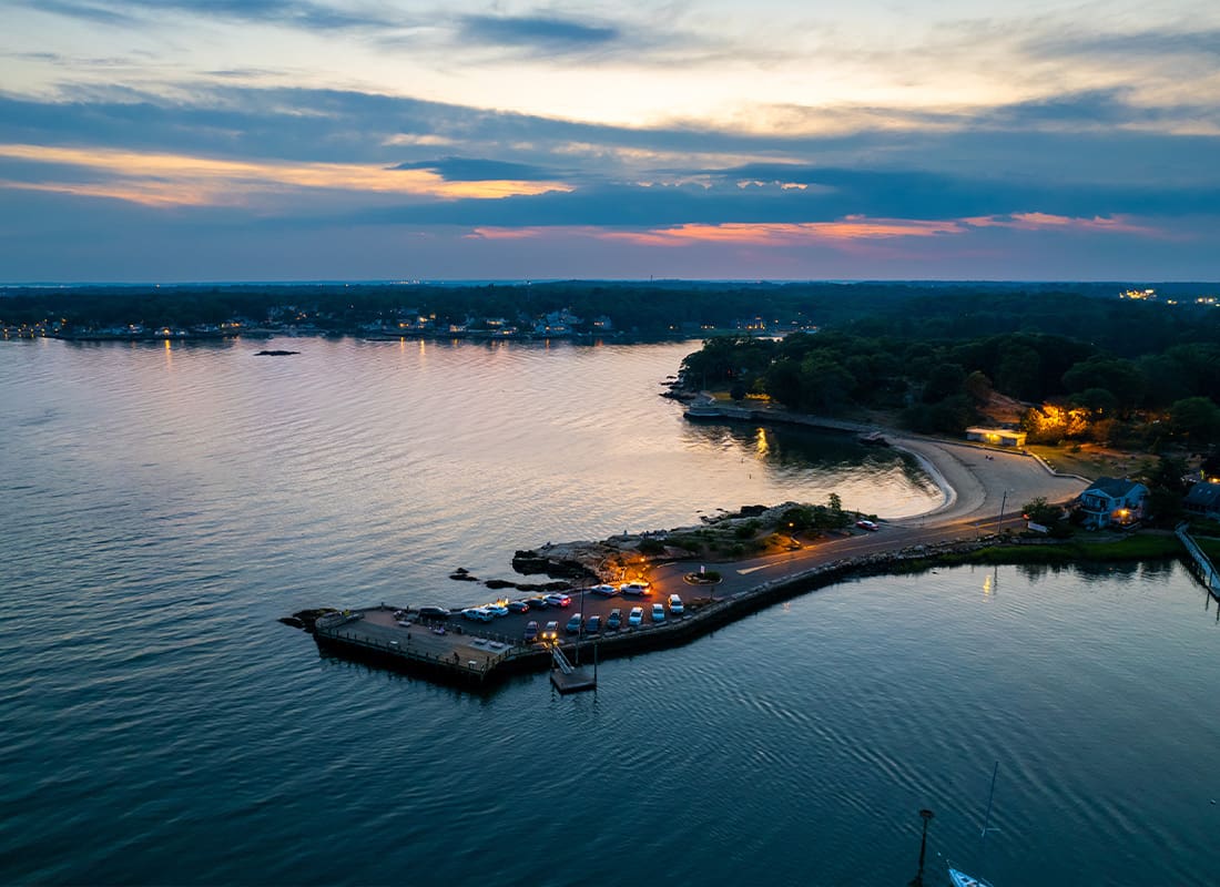 Contact - Aerial View at Branford Point in Branford, CT With New Haven, CT in the Background During Sunset