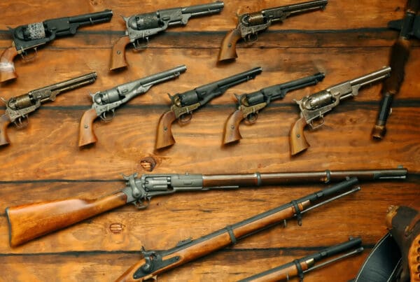 Does Your Homeowners Insurance Cover Firearms? - Group of FireArms Lined Up
