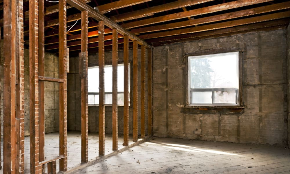 Eliminating Odors in Your Home: A CT Family’s Surprise Behind the Wall. Bedroom with open walls.