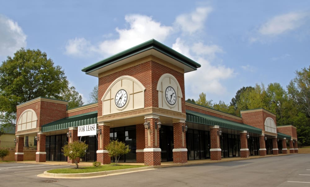 Insurance Considerations for Connecticut’s Commercial Spaces. Brick building with large clock tower.