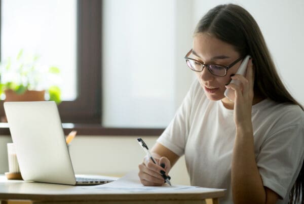 Young homeowner calling her insurance agent