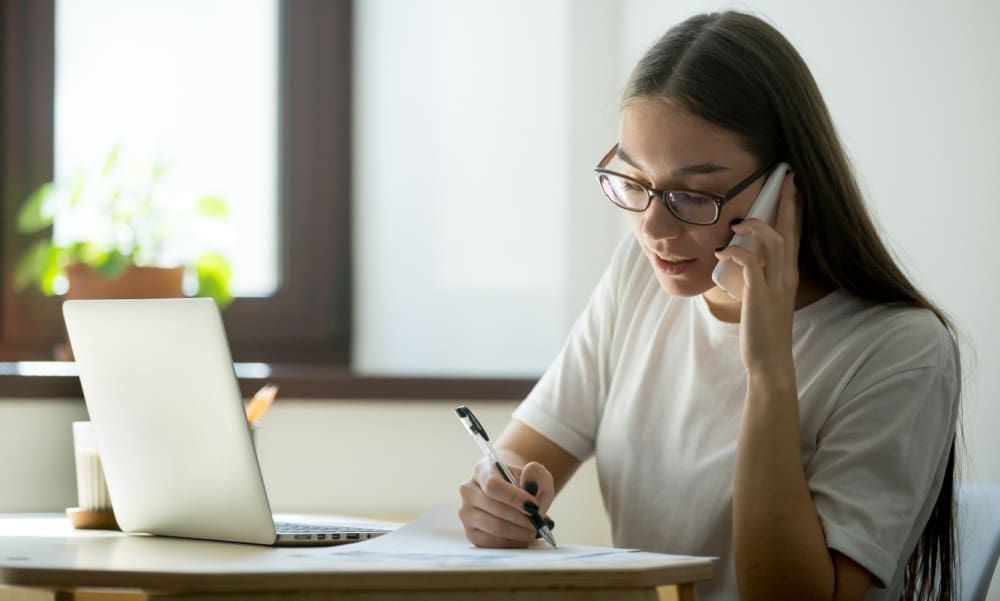 Young homeowner calling her insurance agent